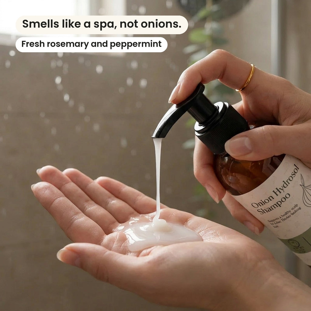Onion Hydrosol Shampoo pumped into a hand. Smells like a spa, not onions.