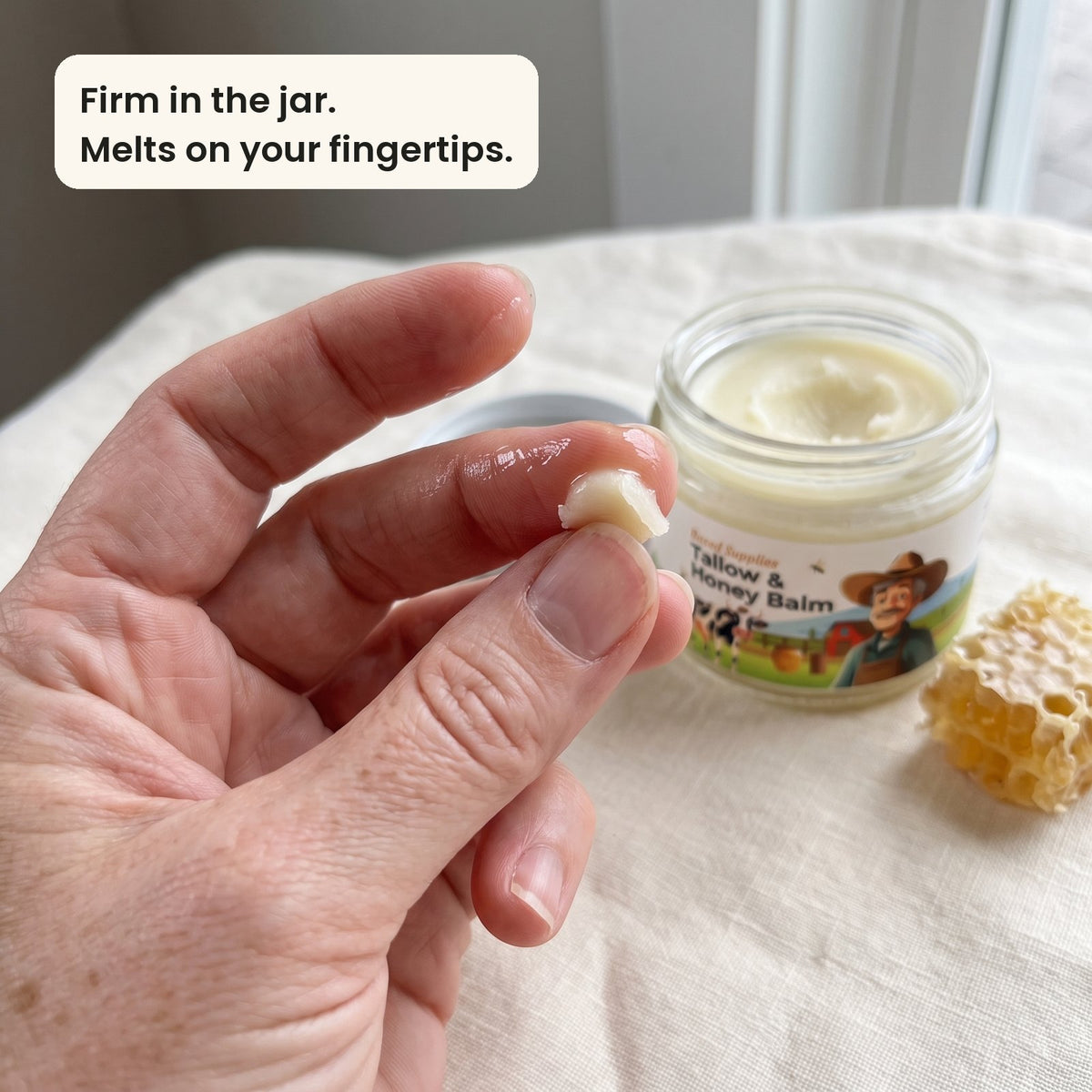 A pea-size bit of firm balm melting between two fingertips